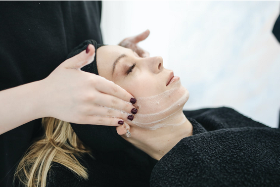 Image of a woman receiving a facial massage
